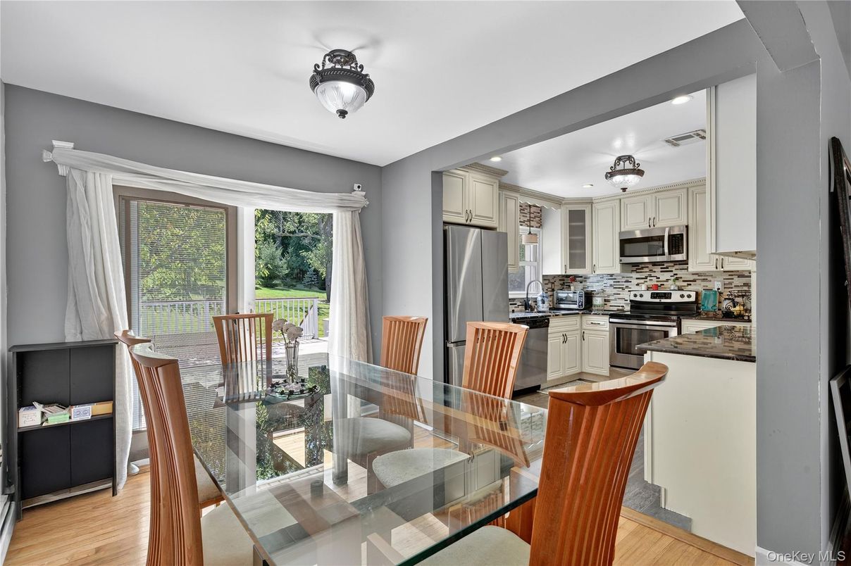 Dining room, Interior, Kitchen, Recessed Lighting, Stainless Steel Appliances, Wood Texture Flooring