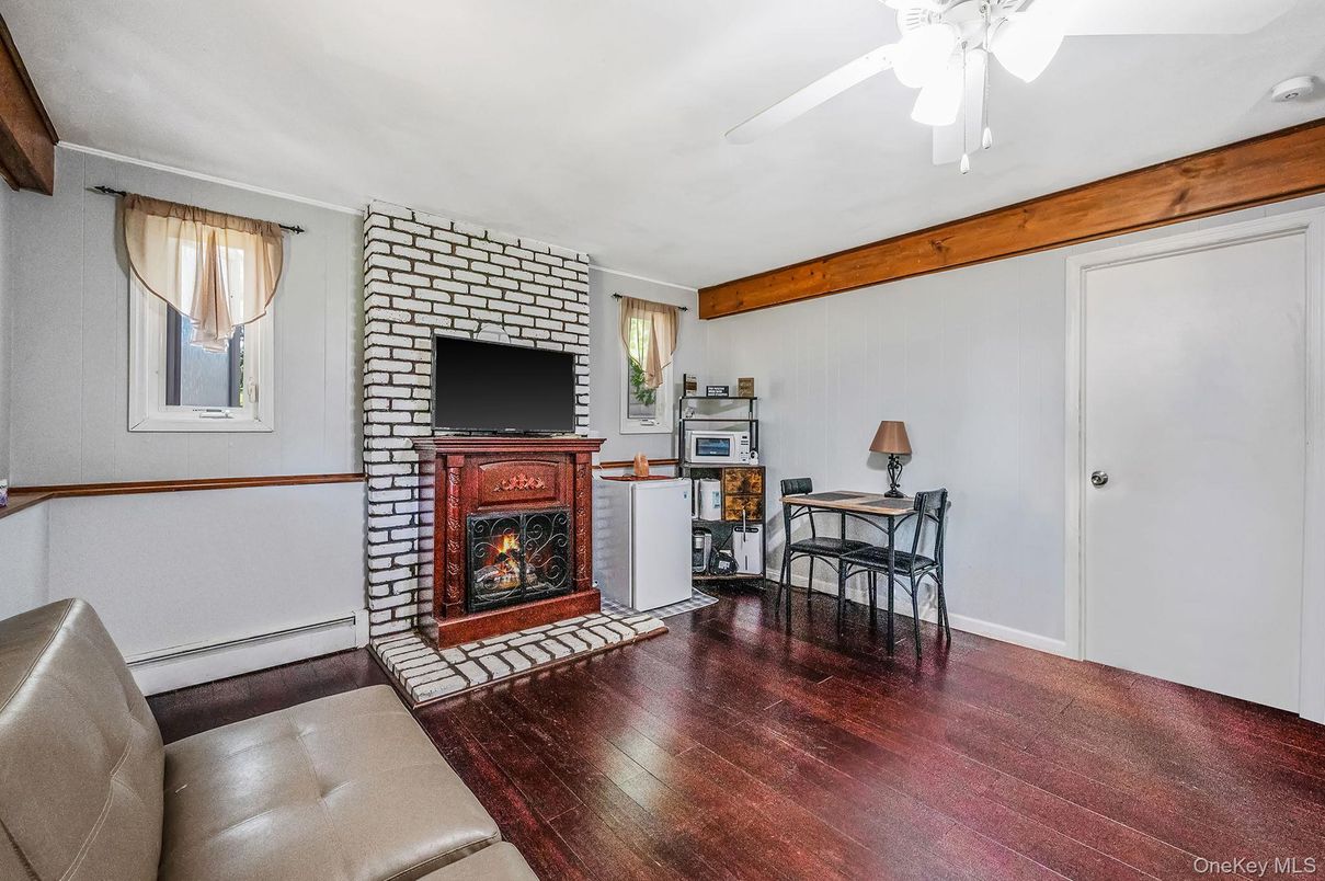 Dining room, Fireplace, Interior, Stone Walls, Wooden Beams, Wood Texture Flooring