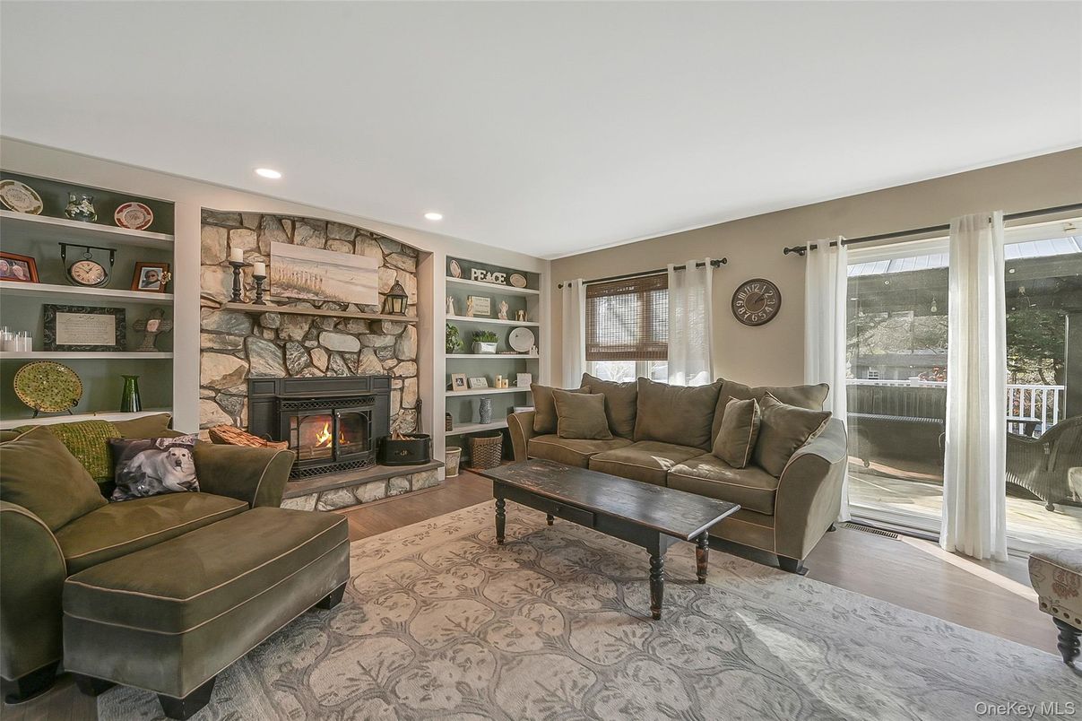 Fireplace, Interior, Living room, Recessed Lighting, Stone Walls, Wood Texture Flooring