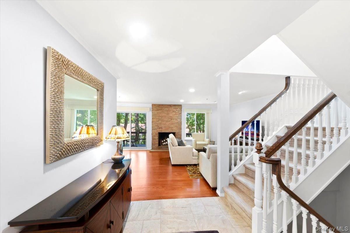 Fireplace, Interior, Living room, Recessed Lighting, Stone Walls, Wood Texture Flooring