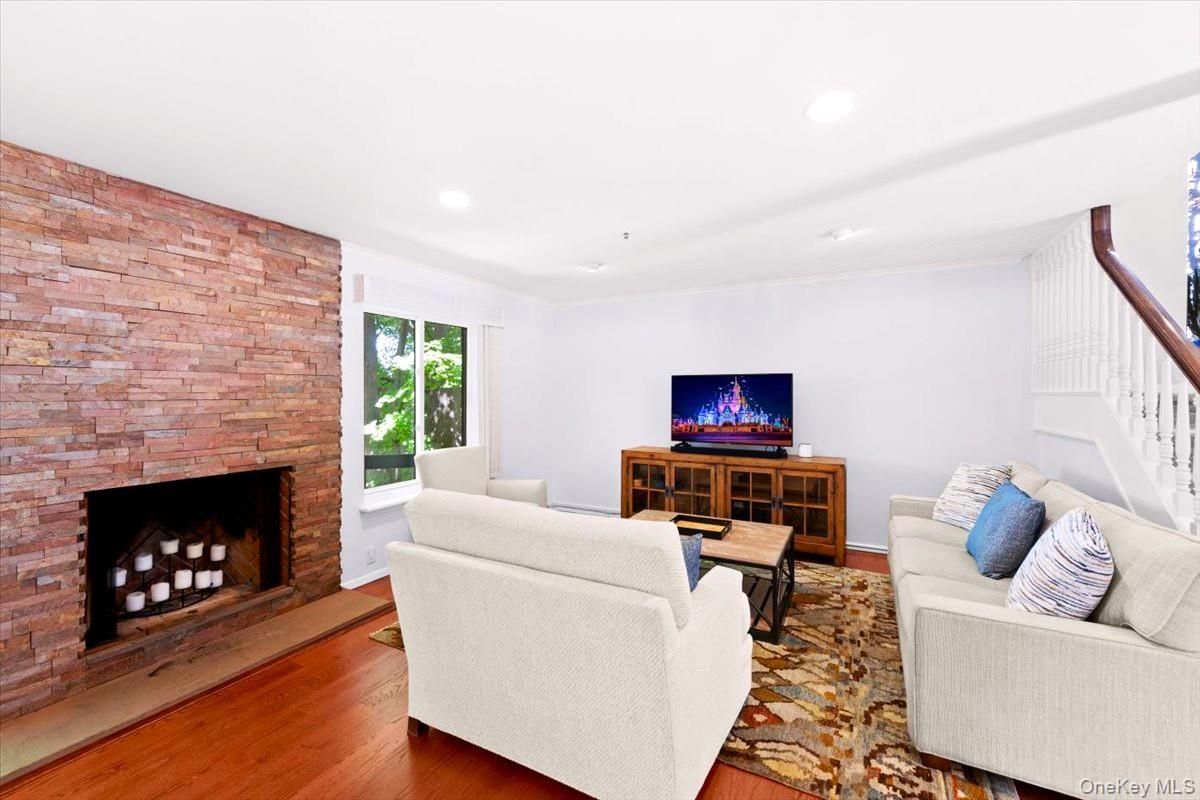 Fireplace, Interior, Living room, Recessed Lighting, Stone Walls, Wood Texture Flooring