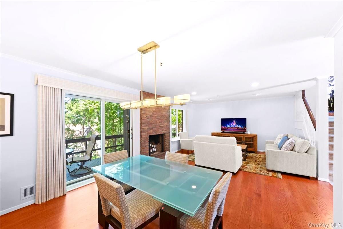 Dining room, Fireplace, Interior, Living room, Pendant Lights, Recessed Lighting, Wood Texture Flooring