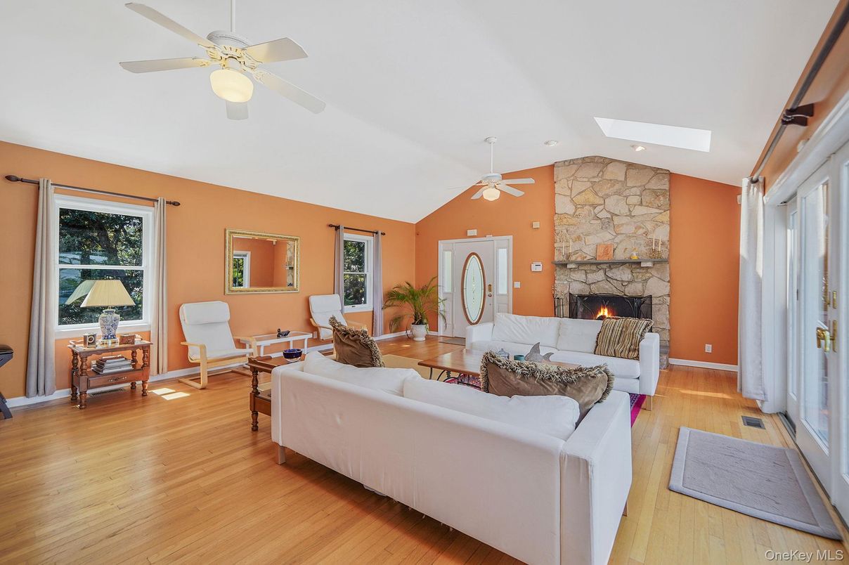 Fireplace, Interior, Living room, Recessed Lighting, Stone Walls, Wood Texture Flooring