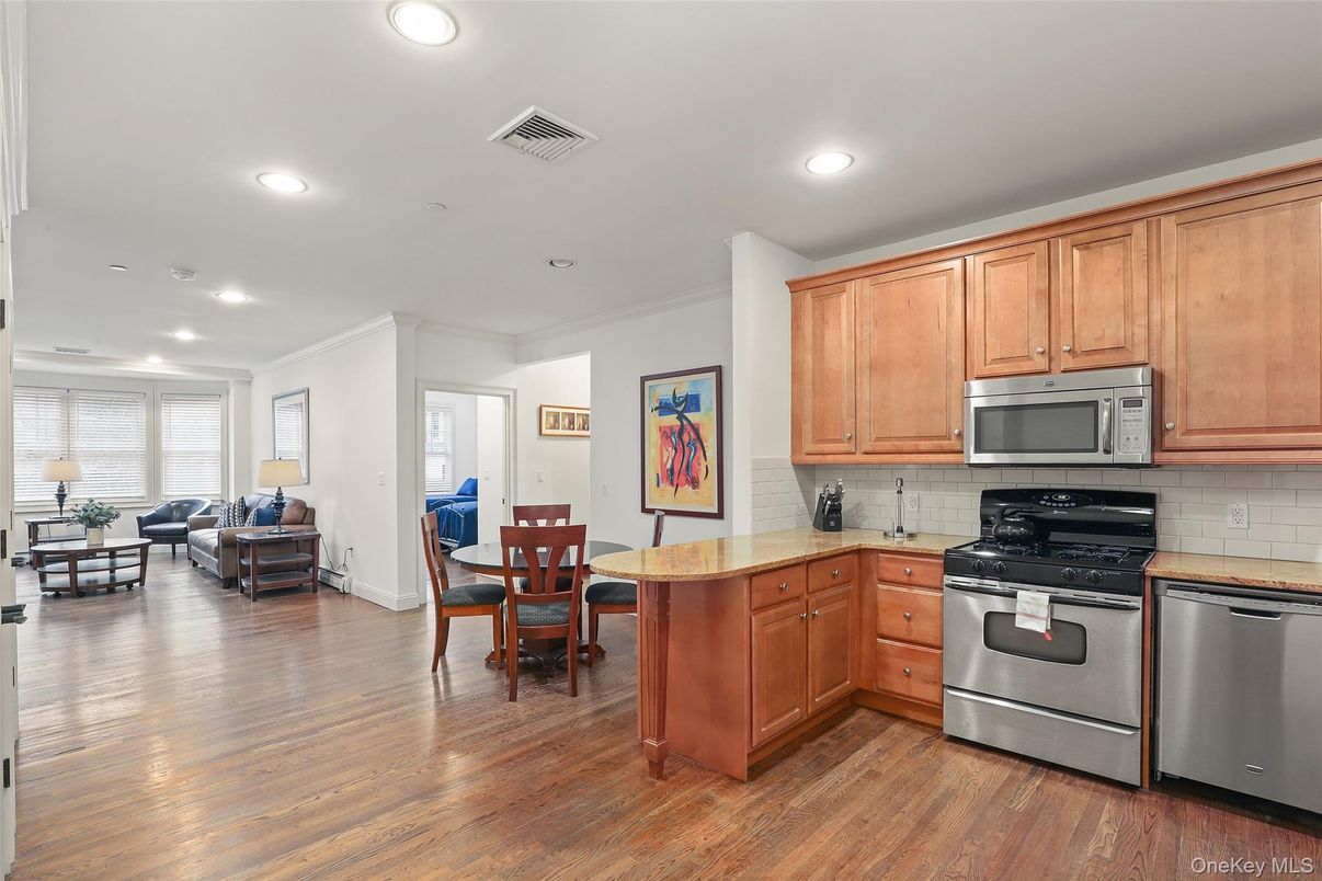 Dining room, Interior, Kitchen, Living room, Recessed Lighting, Stainless Steel Appliances, Wood Texture Flooring