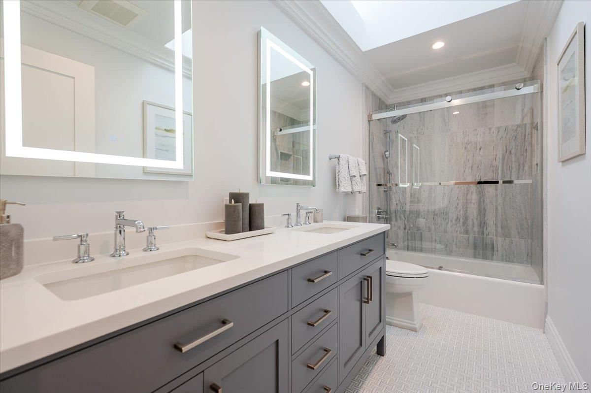 Bathroom, Dual Sink Vanities, Glass Shower, Interior, Marble Walls, Recessed Lighting