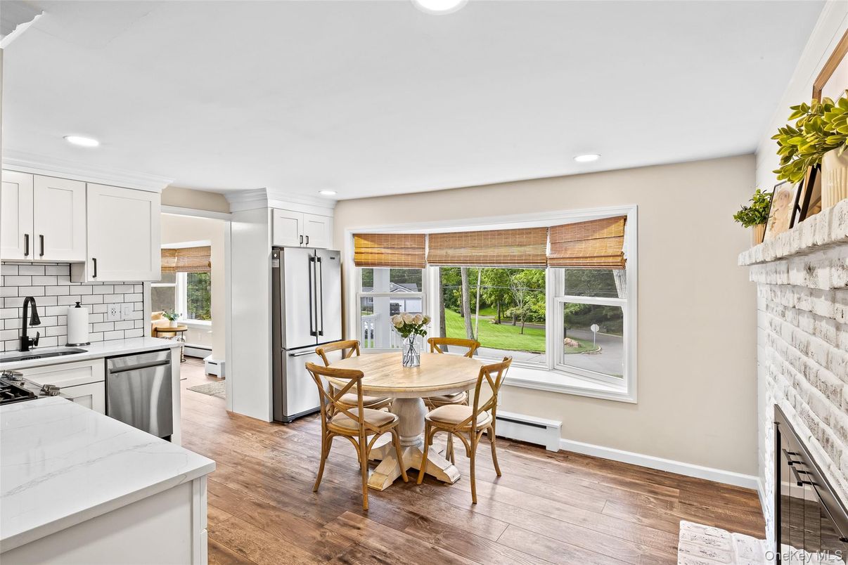 Dining room, Fireplace, Interior, Kitchen, Recessed Lighting, Wood Texture Flooring