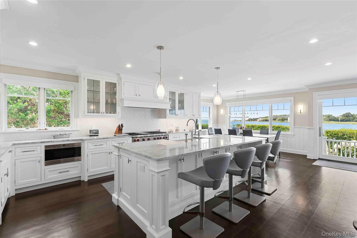 Dining room, Interior, Kitchen, Pendant Lights, Recessed Lighting, Stainless Steel Appliances, Water, Wood Texture Flooring