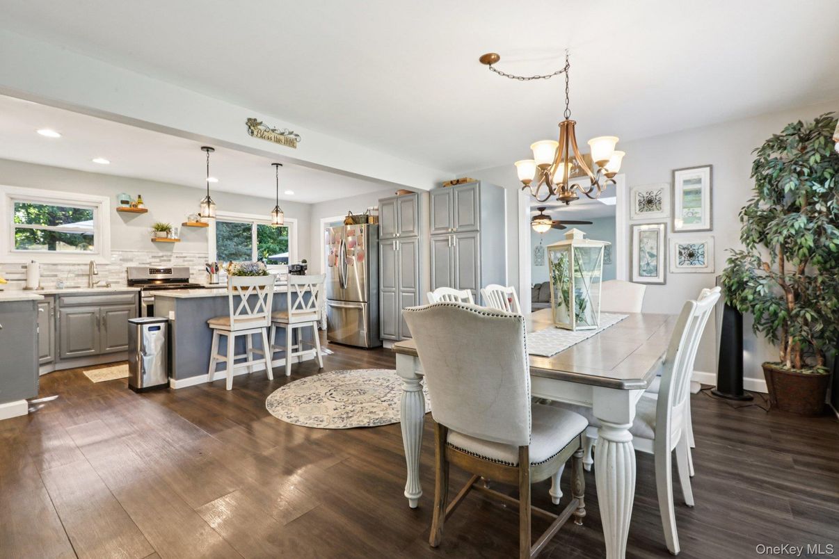Chandelier, Dining room, Interior, Kitchen, Pendant Lights, Recessed Lighting, Stainless Steel Appliances, Wood Texture Flooring
