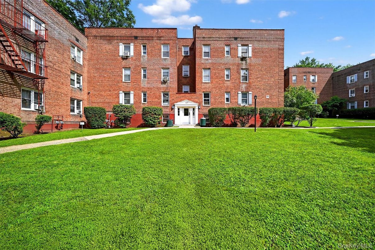 Backyard, Exterior, Facade, Brick Facade, Condo Building