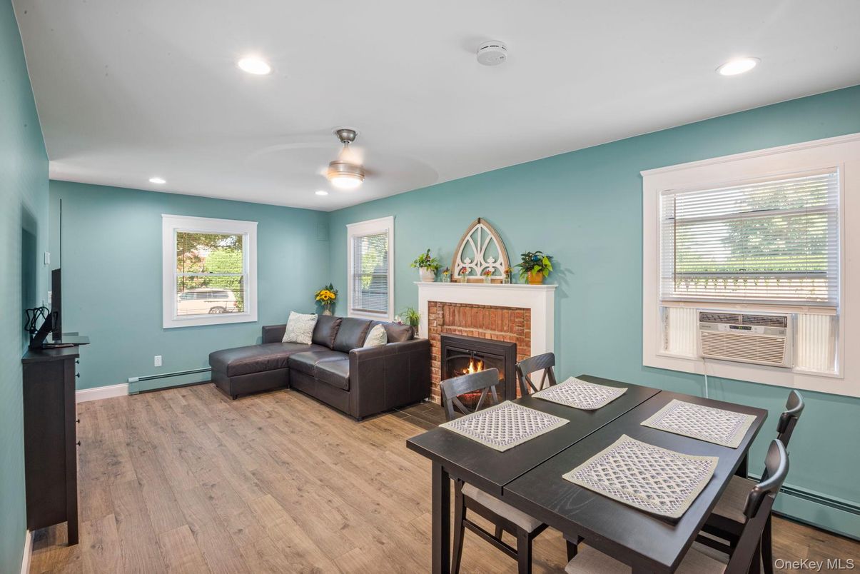 Dining room, Fireplace, Interior, Living room, Recessed Lighting, Wood Texture Flooring