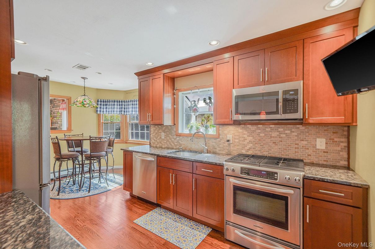 Dining room, Interior, Kitchen, Pendant Lights, Recessed Lighting, Stainless Steel Appliances, Wood Texture Flooring