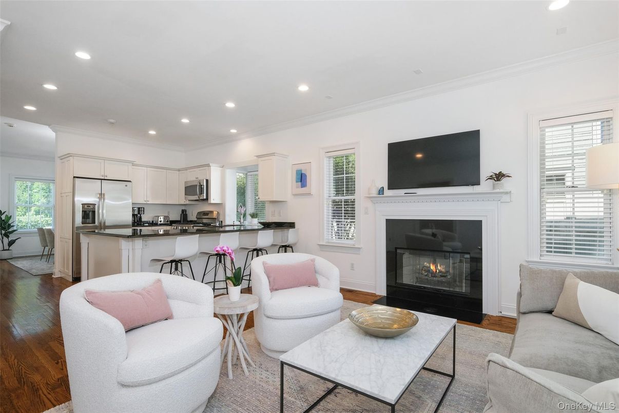 Fireplace, Interior, Kitchen, Living room, Recessed Lighting, Stainless Steel Appliances, Wood Texture Flooring