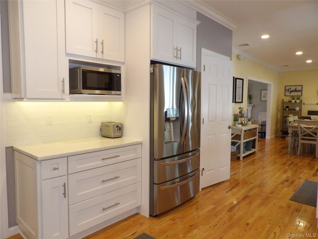 Dining room, Interior, Kitchen, Recessed Lighting, Stainless Steel Appliances, Wood Texture Flooring