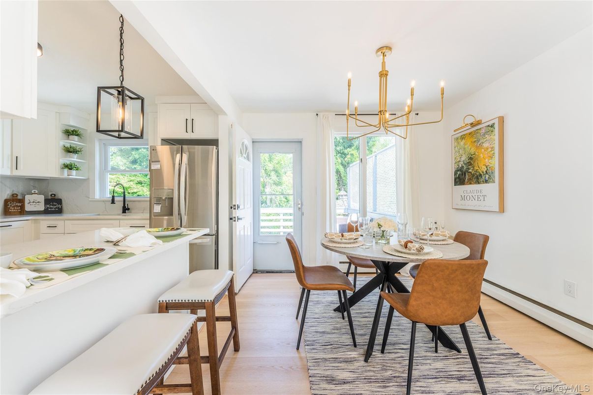 Chandelier, Dining room, Interior, Kitchen, Pendant Lights, Stainless Steel Appliances, Wood Texture Flooring