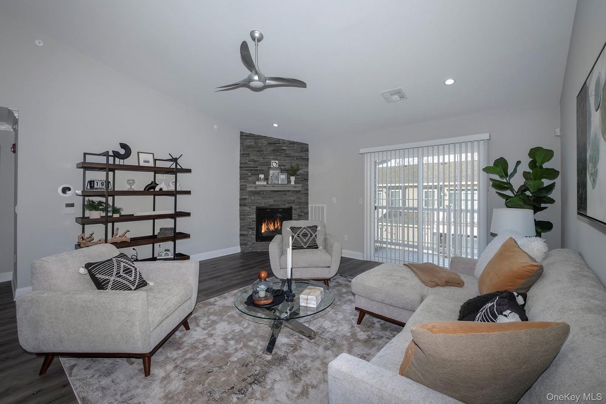 Fireplace, Interior, Living room, Recessed Lighting, Stone Walls, Wood Texture Flooring
