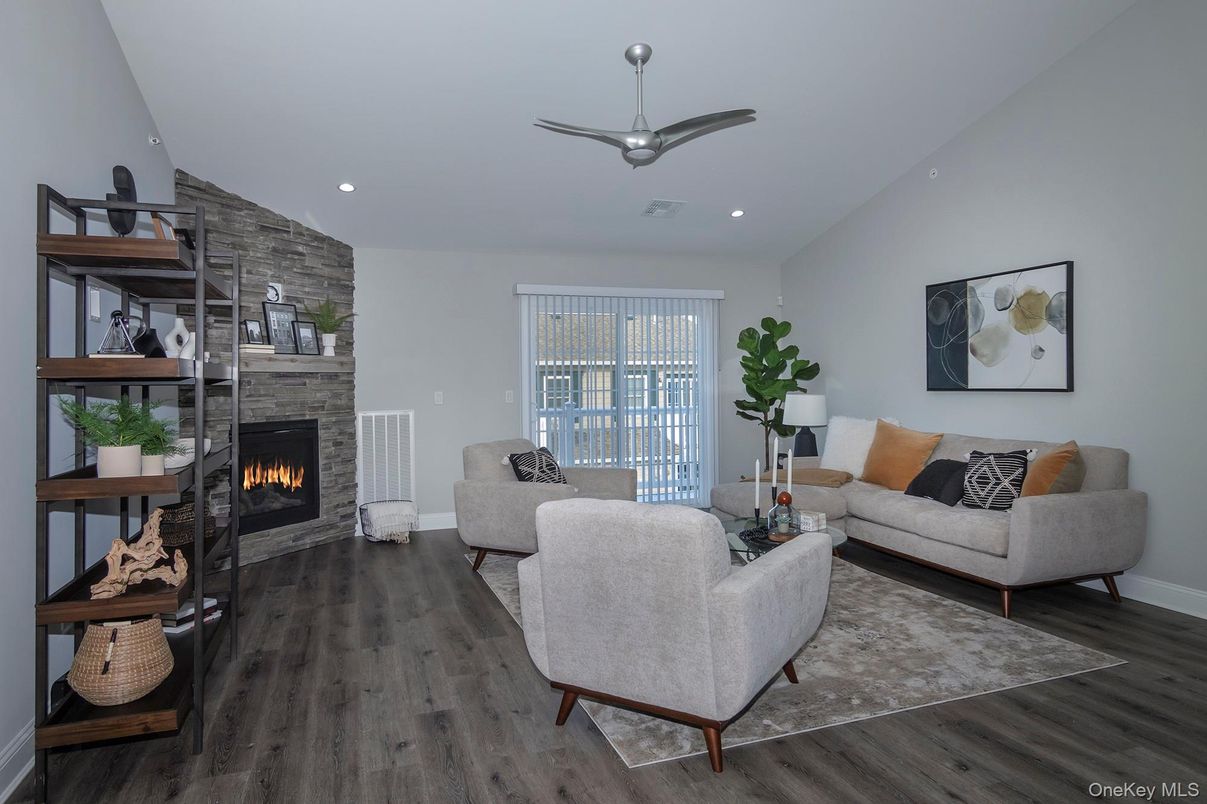 Fireplace, Interior, Living room, Recessed Lighting, Stone Walls, Wood Texture Flooring