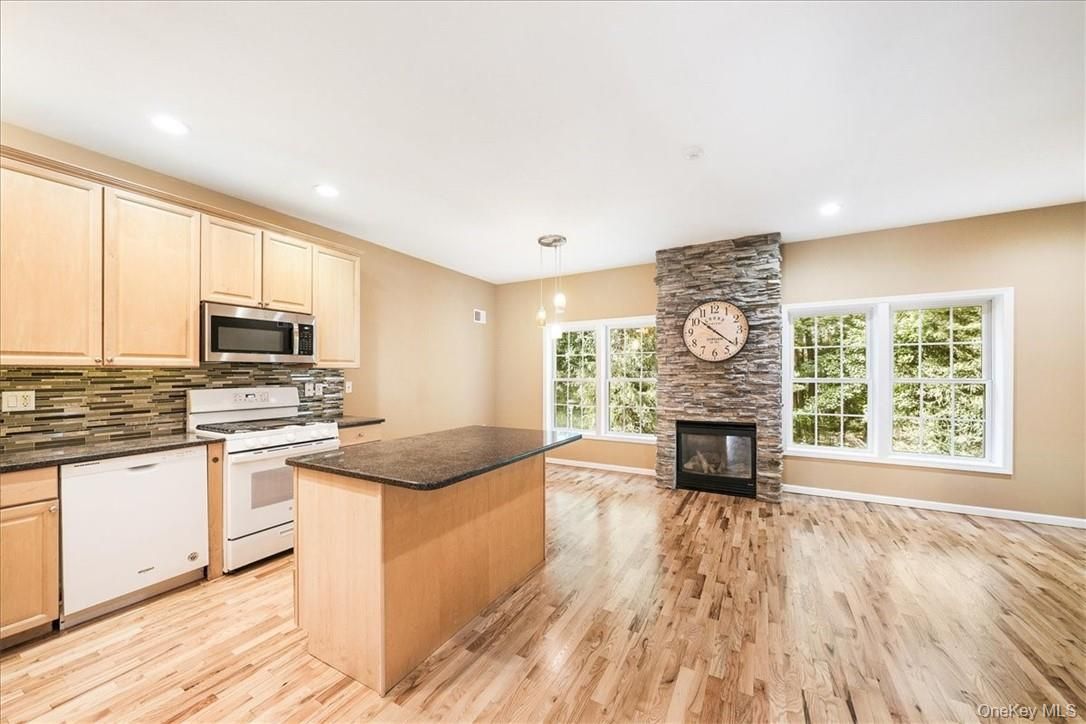 Fireplace, Interior, Kitchen, Pendant Lights, Recessed Lighting, Stone Walls, Wood Texture Flooring
