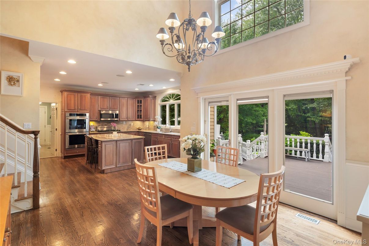 Chandelier, Dining room, Interior, Kitchen, Recessed Lighting, Stainless Steel Appliances, Wood Texture Flooring
