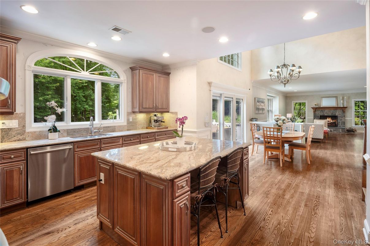 Chandelier, Dining room, Fireplace, Interior, Kitchen, Recessed Lighting, Wood Texture Flooring