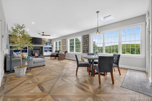 Dining room, Fireplace, Interior, Living room, Pendant Lights, Recessed Lighting, Wood Texture Flooring