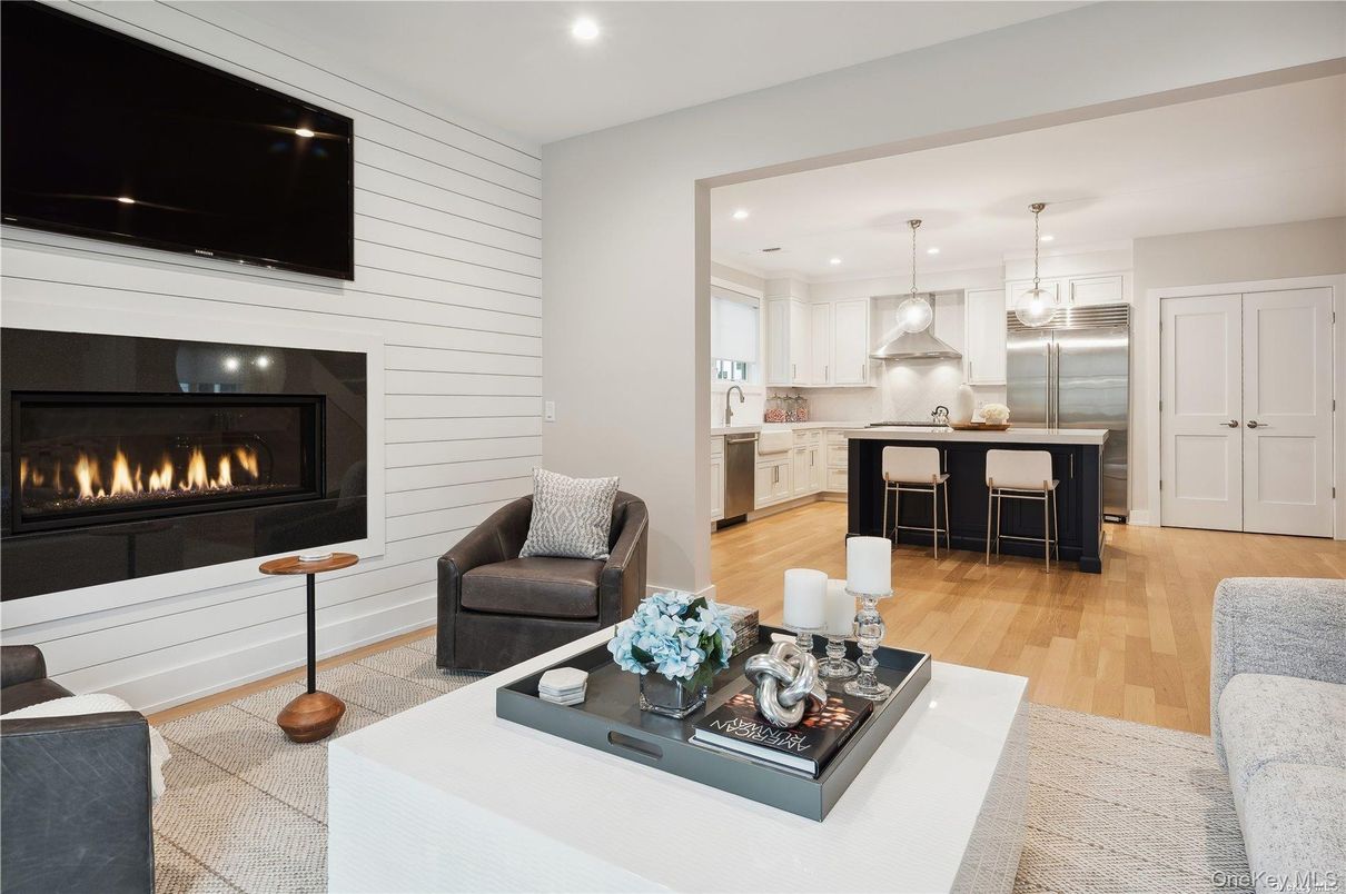 Fireplace, Interior, Kitchen, Living room, Pendant Lights, Recessed Lighting, Stainless Steel Appliances, Wood Texture Flooring