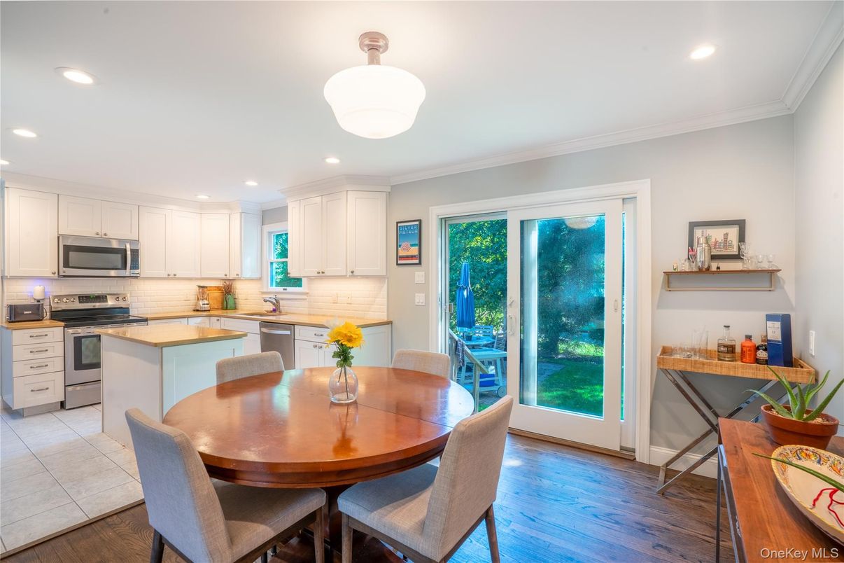 Dining room, Interior, Kitchen, Recessed Lighting, Stainless Steel Appliances, Wood Texture Flooring