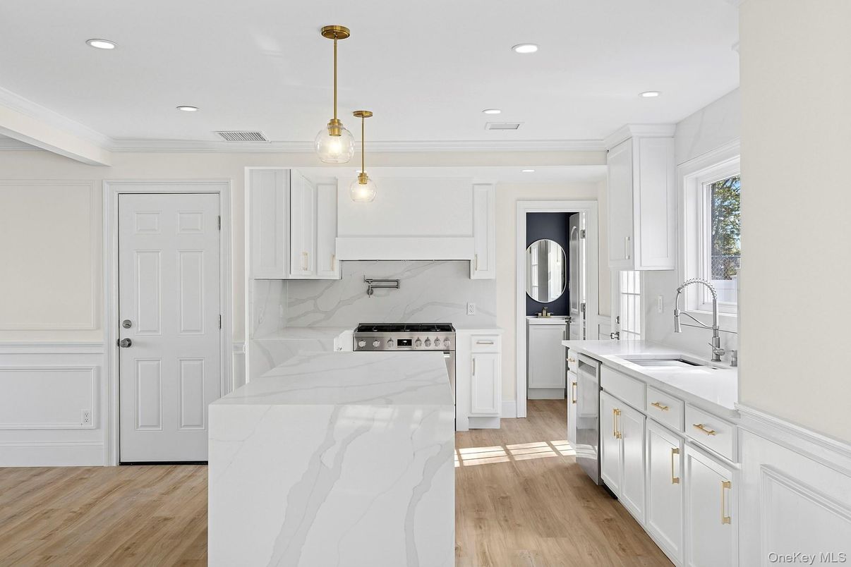Interior, Kitchen, Marble Walls, Pendant Lights, Recessed Lighting, Stainless Steel Appliances, Wood Texture Flooring