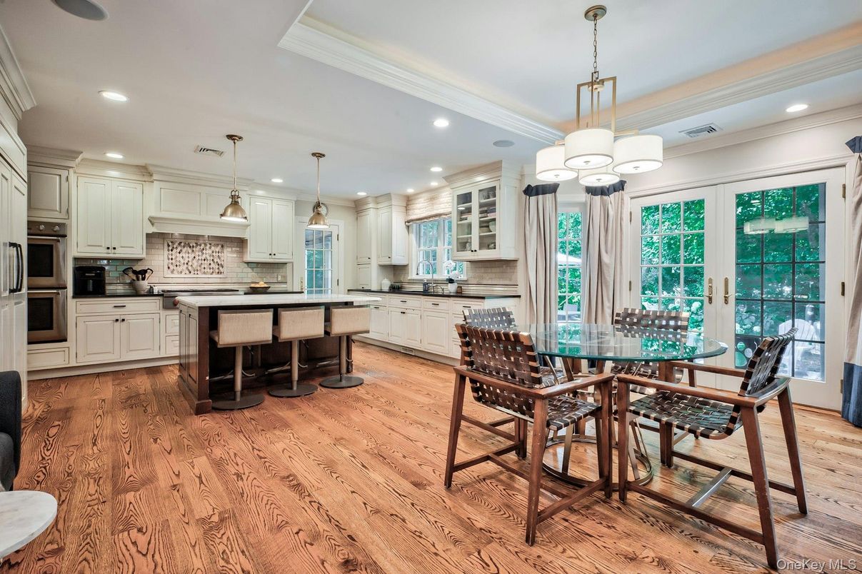 Chandelier, Dining room, Interior, Kitchen, Pendant Lights, Recessed Lighting, Stainless Steel Appliances, Wood Texture Flooring