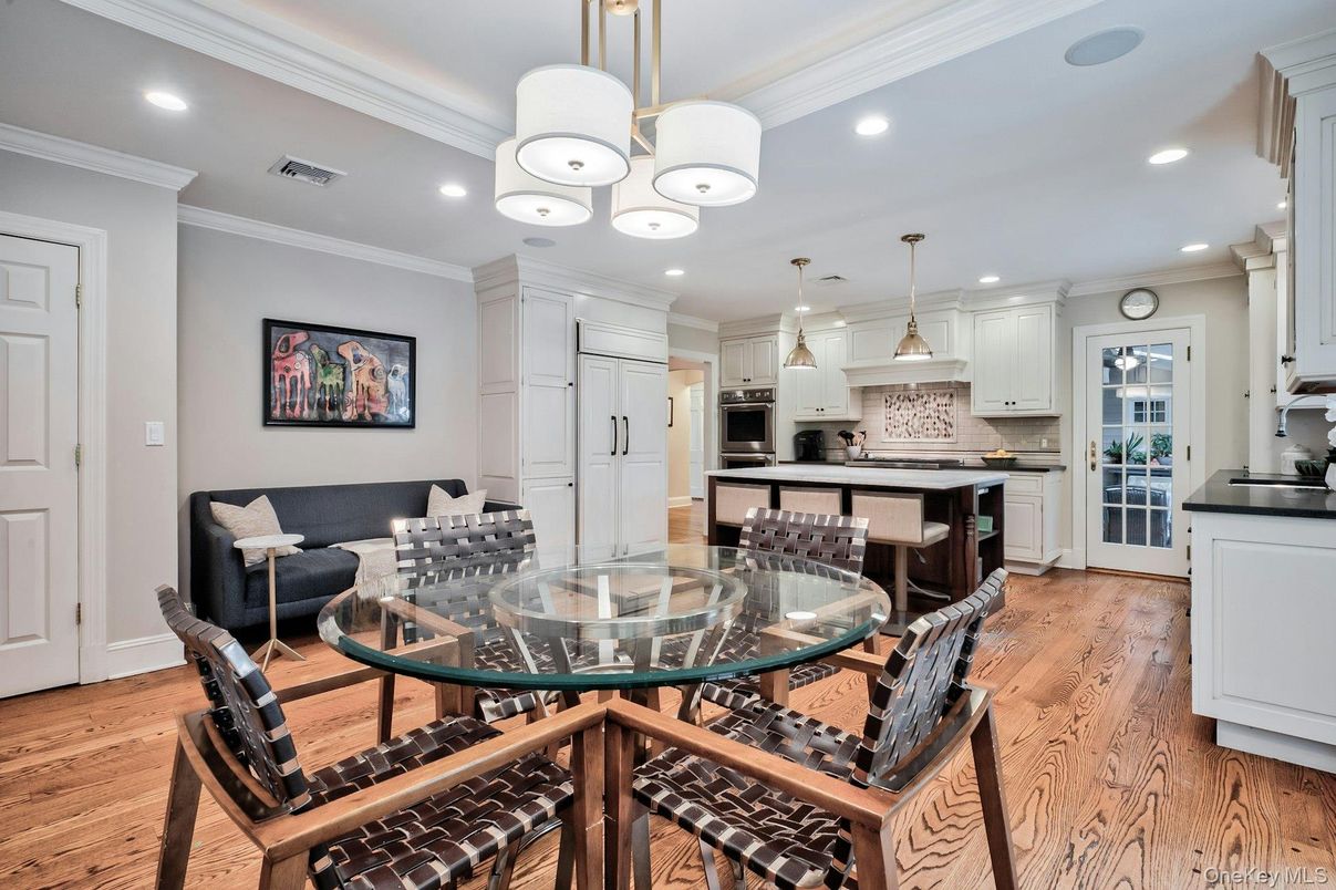Dining room, Interior, Kitchen, Pendant Lights, Recessed Lighting, Stainless Steel Appliances, Wood Texture Flooring