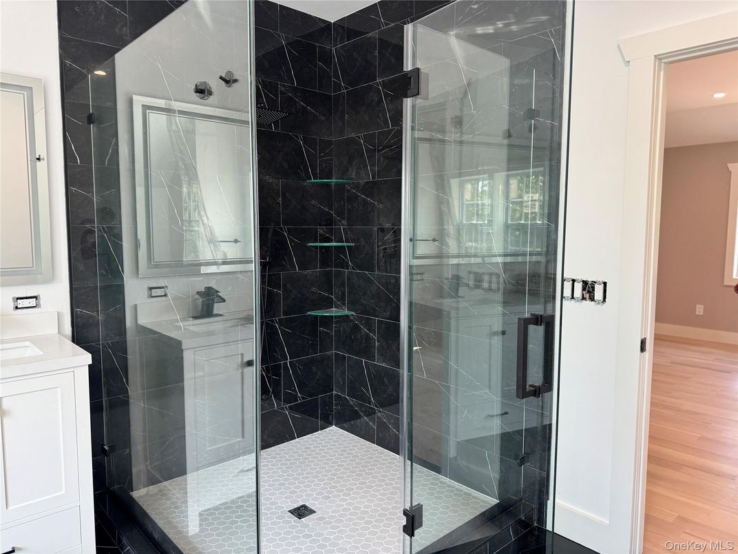 Bathroom, Glass Shower, Interior, Marble Walls, Recessed Lighting, Wood Texture Flooring