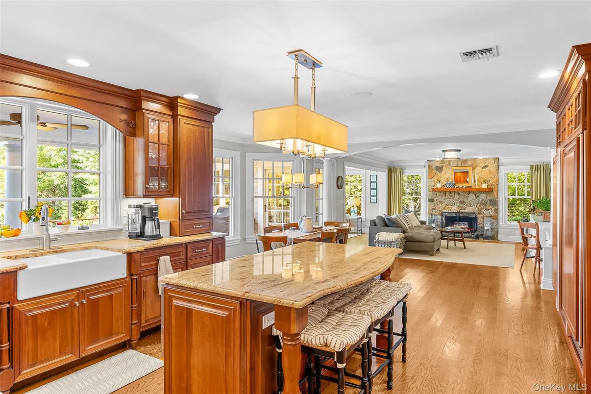 Chandelier, Dining room, Fireplace, Interior, Kitchen, Living room, Pendant Lights, Recessed Lighting, Wood Texture Flooring