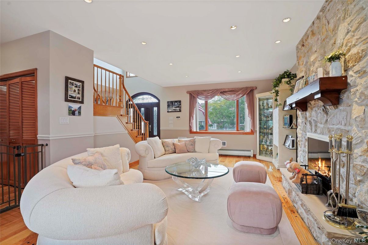 Fireplace, Interior, Living room, Recessed Lighting, Stone Walls, Wood Texture Flooring