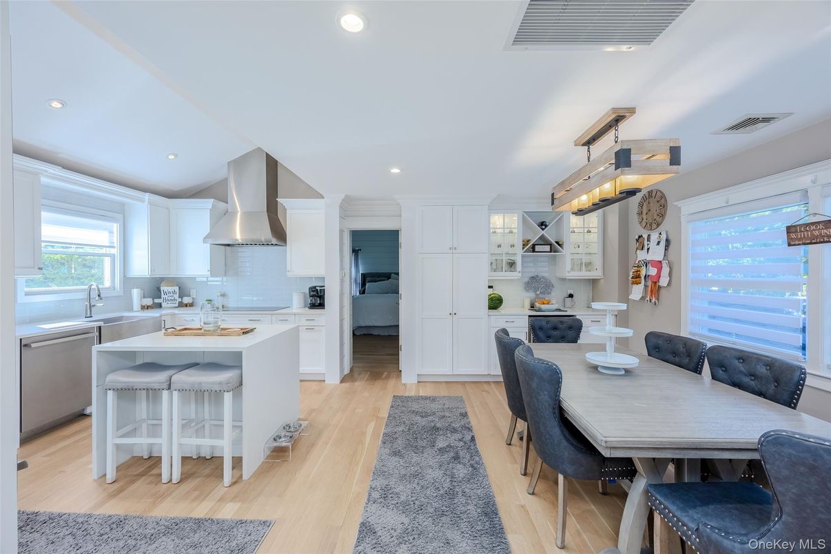 Dining room, Interior, Kitchen, Pendant Lights, Recessed Lighting, Stainless Steel Appliances, Wood Texture Flooring