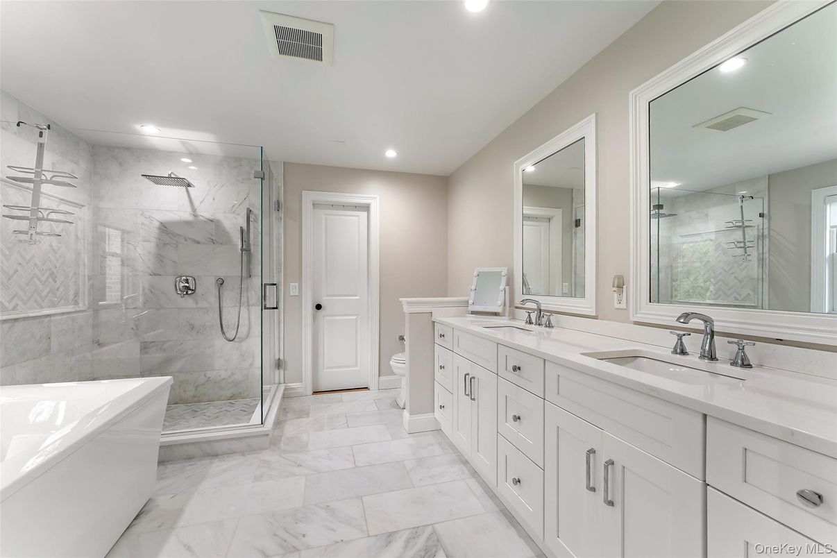 Bathroom, Dual Sink Vanities, Glass Shower, Interior, Marble, Marble Walls, Recessed Lighting