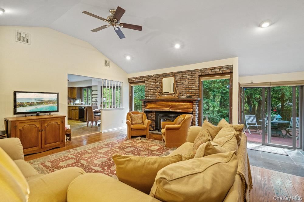 Fireplace, Interior, Living room, Recessed Lighting, Stone Walls, Wood Texture Flooring