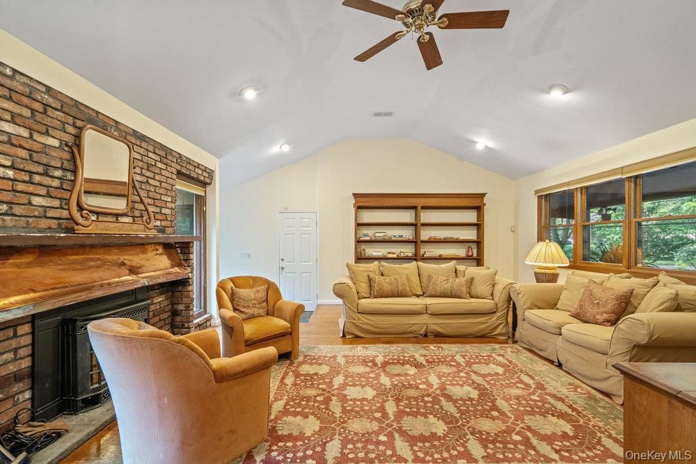 Fireplace, Interior, Living room, Recessed Lighting, Stone Walls, Wood Texture Flooring