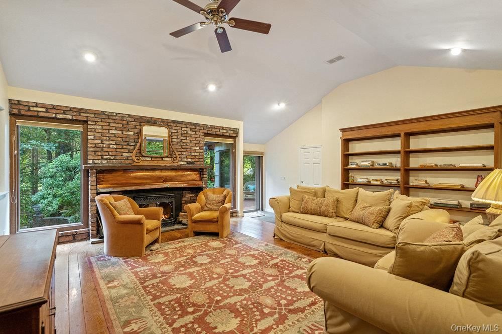 Fireplace, Interior, Living room, Recessed Lighting, Stone Walls, Wood Texture Flooring