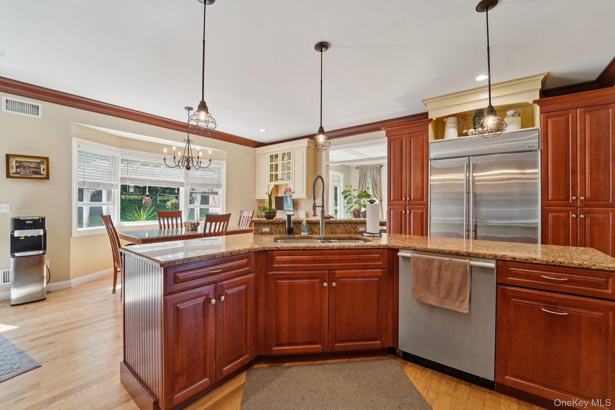 Chandelier, Dining room, Interior, Kitchen, Pendant Lights, Recessed Lighting, Stainless Steel Appliances, Wood Texture Flooring