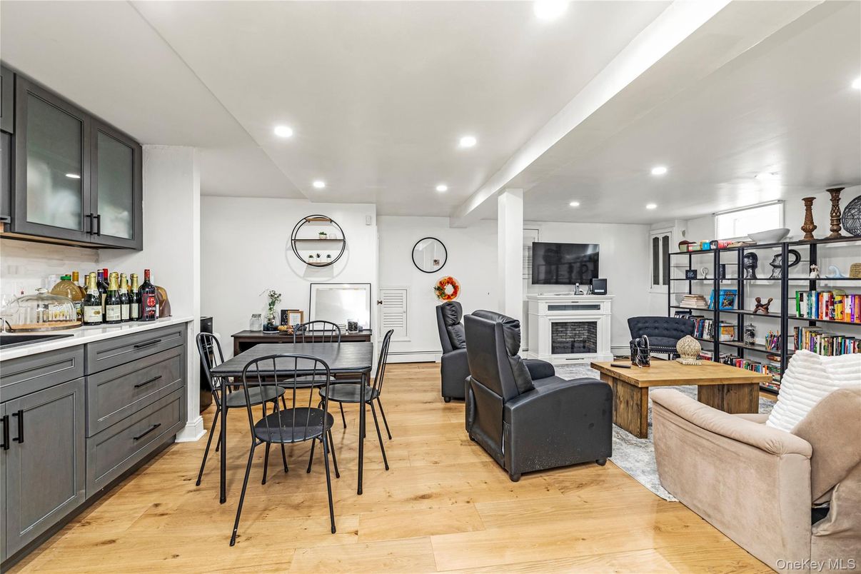 Dining room, Fireplace, Interior, Living room, Recessed Lighting, Wood Texture Flooring