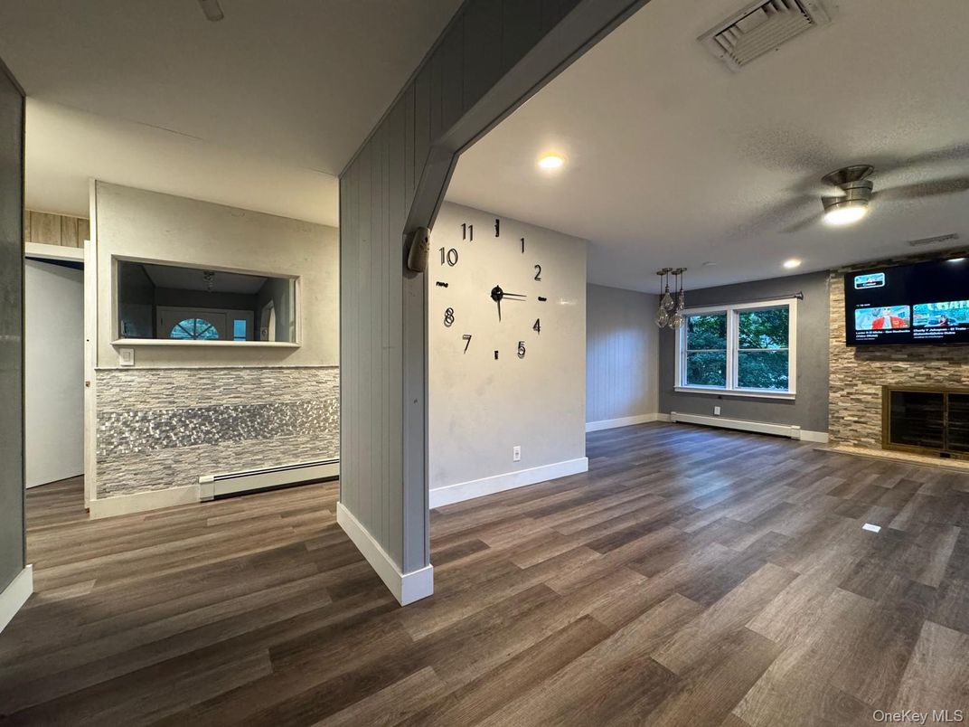Empty room, Fireplace, Interior, Recessed Lighting, Stone Walls, Wood Texture Flooring