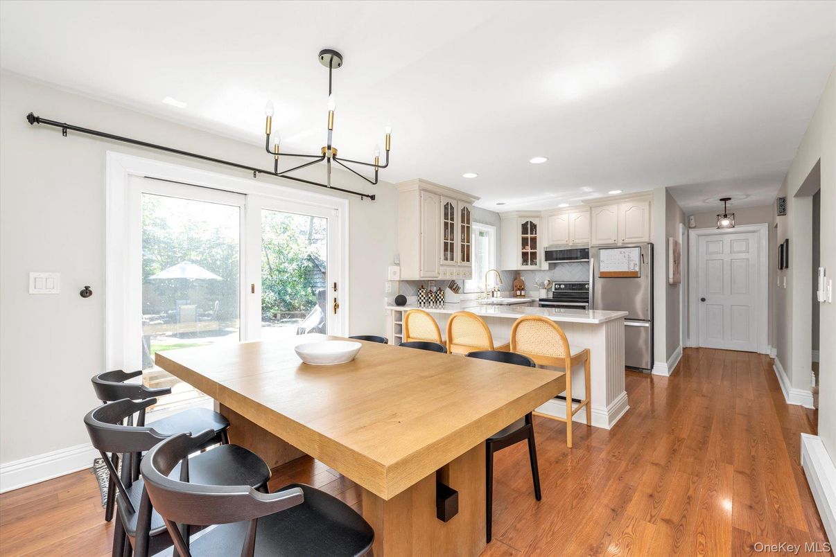 Dining room, Interior, Kitchen, Pendant Lights, Recessed Lighting, Stainless Steel Appliances, Wood Texture Flooring