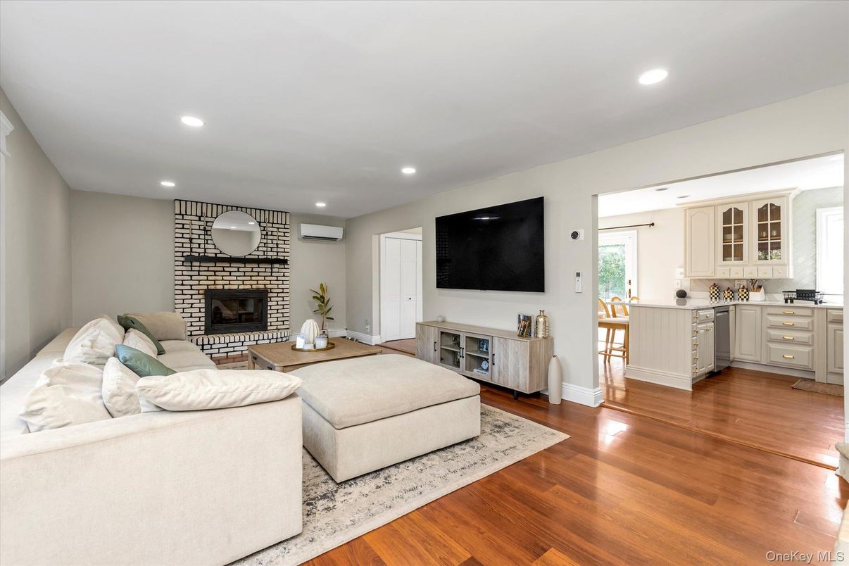Fireplace, Interior, Kitchen, Living room, Recessed Lighting, Stone Walls, Wood Texture Flooring