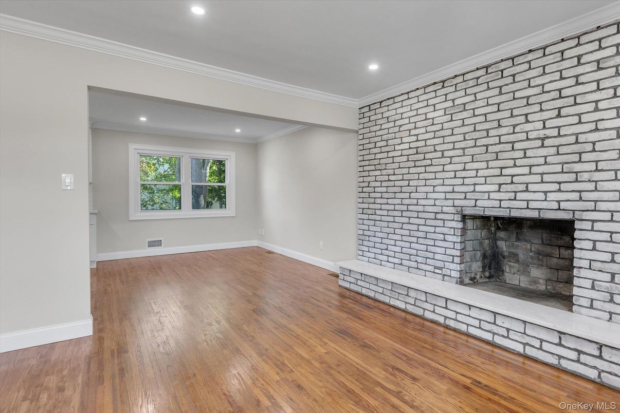 Empty room, Fireplace, Interior, Recessed Lighting, Stone Walls, Wood Texture Flooring