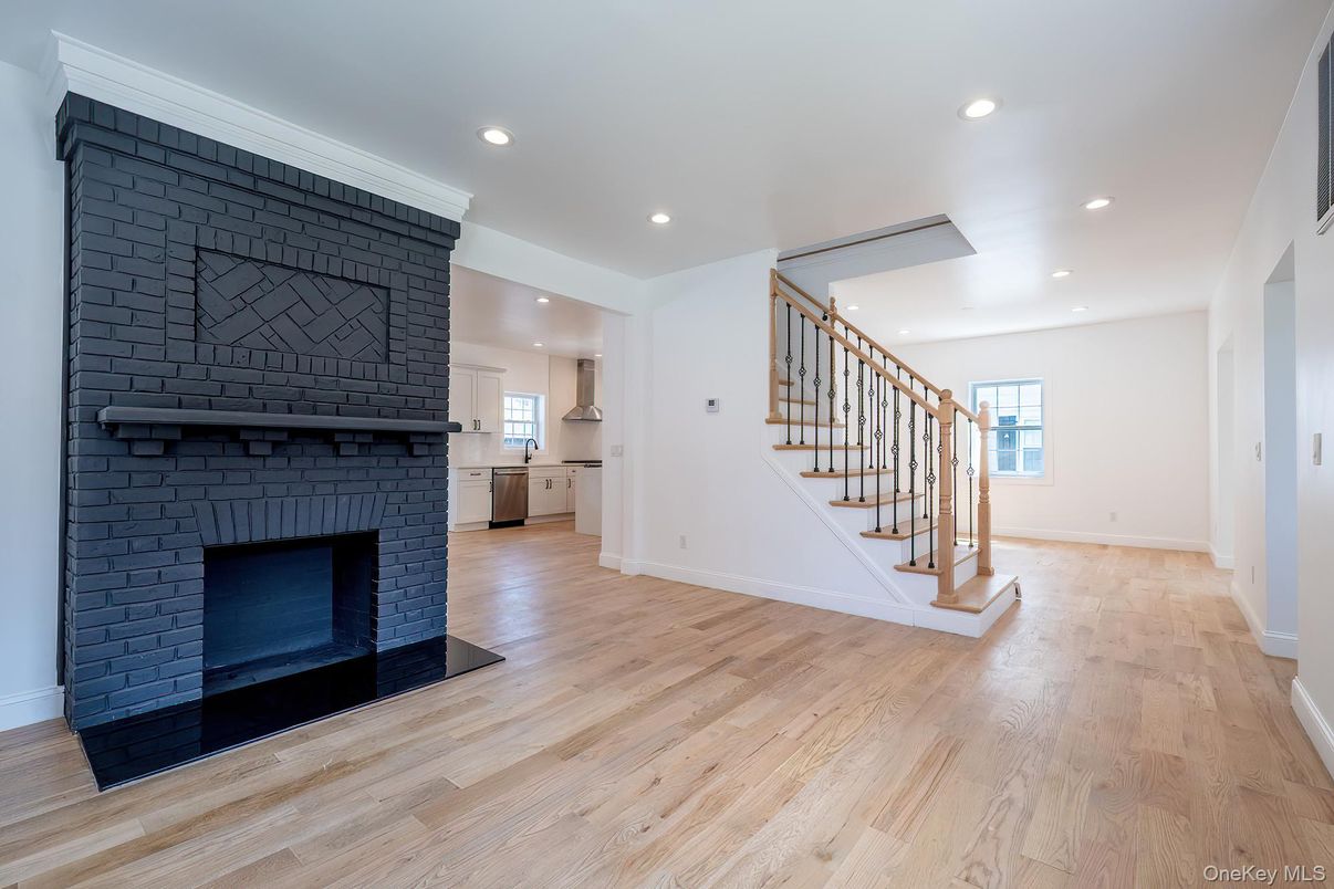 Empty room, Fireplace, Interior, Kitchen, Recessed Lighting, Wood Texture Flooring
