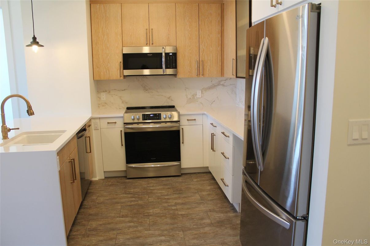 Interior, Kitchen, Marble Walls, Pendant Lights, Stainless Steel Appliances