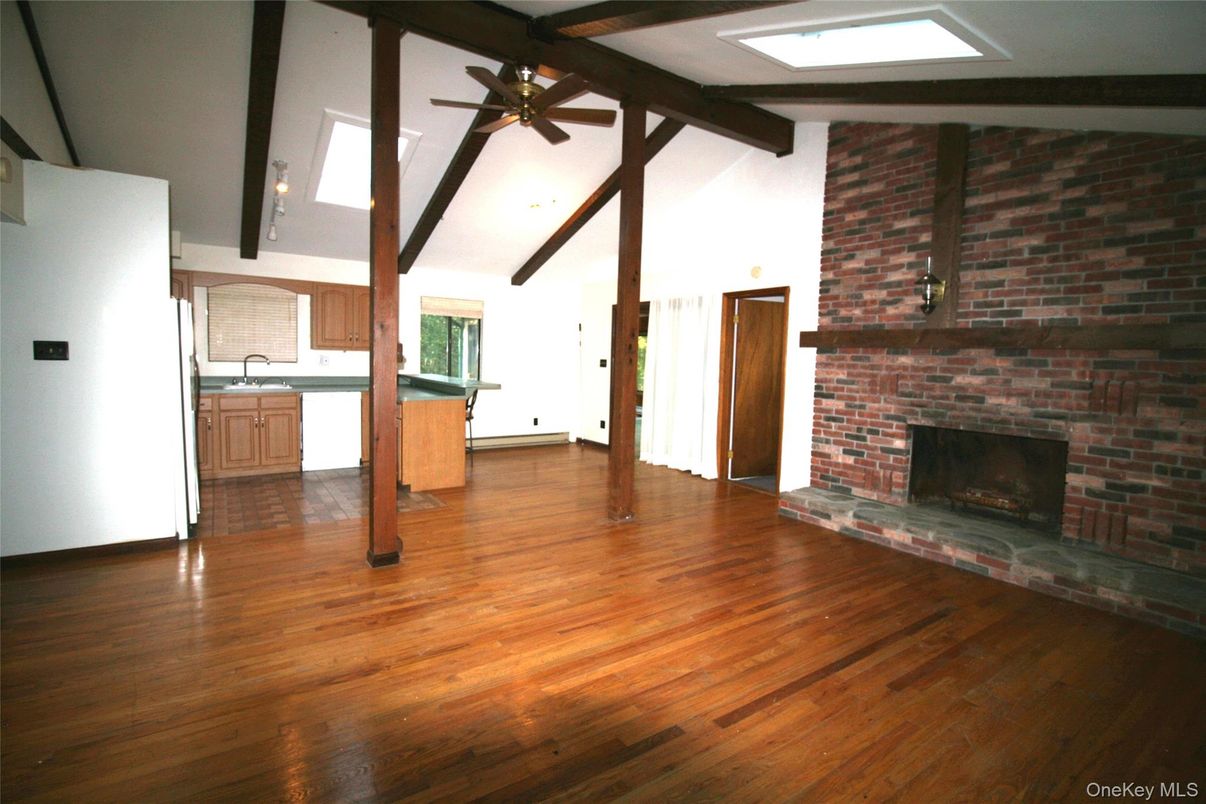 Empty room, Fireplace, Interior, Kitchen, Stone Walls, Wooden Beams, Wood Texture Flooring