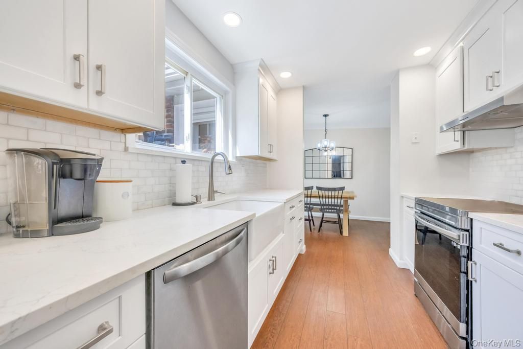Chandelier, Dining room, Interior, Kitchen, Recessed Lighting, Stainless Steel Appliances, Wood Texture Flooring
