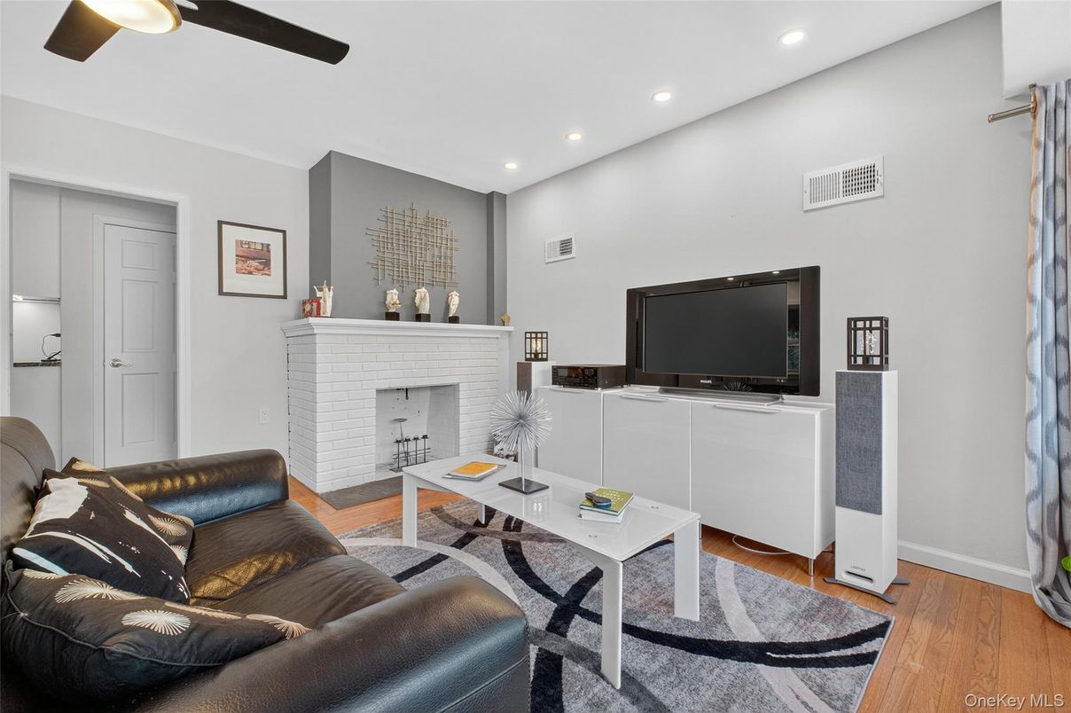 Fireplace, Interior, Living room, Recessed Lighting, Wood Texture Flooring