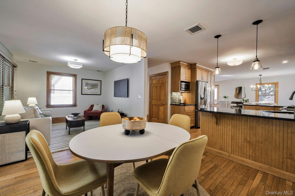 Dining room, Interior, Kitchen, Living room, Pendant Lights, Recessed Lighting, Stainless Steel Appliances, Wood Texture Flooring