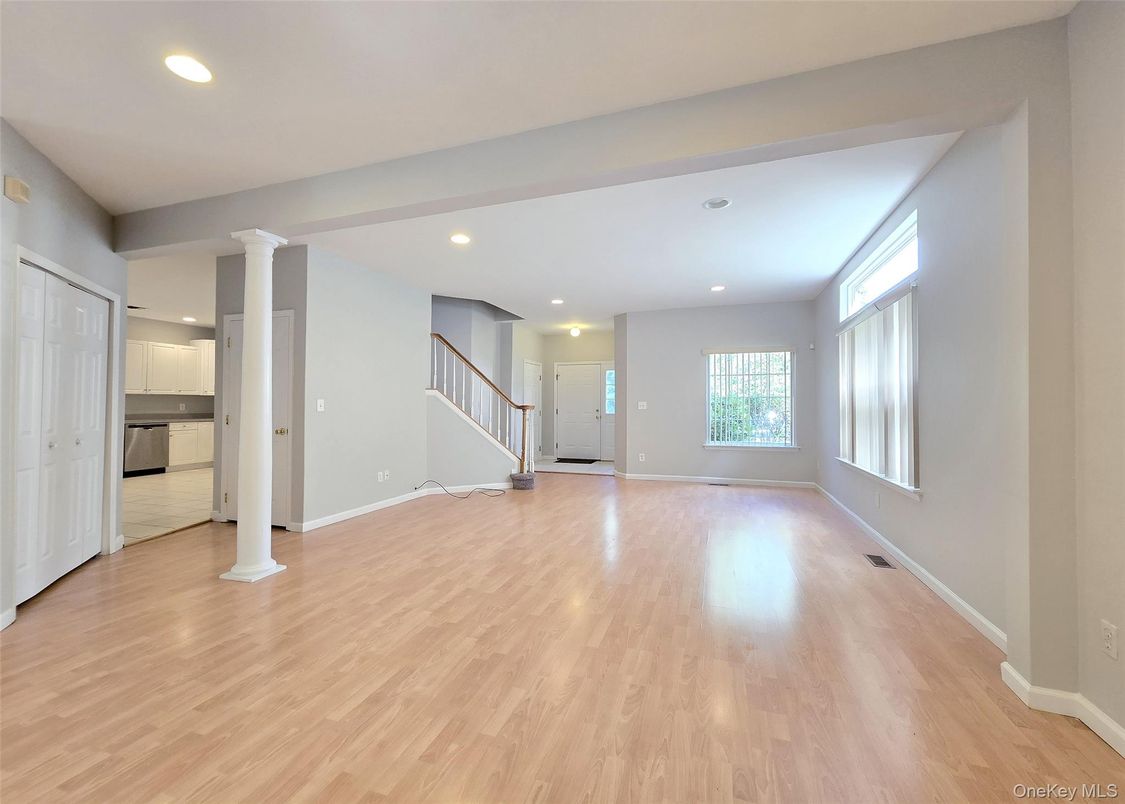 Empty room, Interior, Kitchen, Recessed Lighting, Stainless Steel Appliances, Wood Texture Flooring